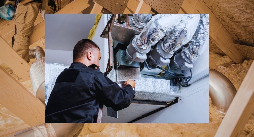 technicien installant un systeme de ventilation mecanique par insufflation dans les combles